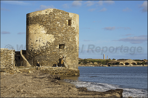 Tower of the salterns near the old tunny fishing nets of Stintino and near the ponds where the pink flamingos gather