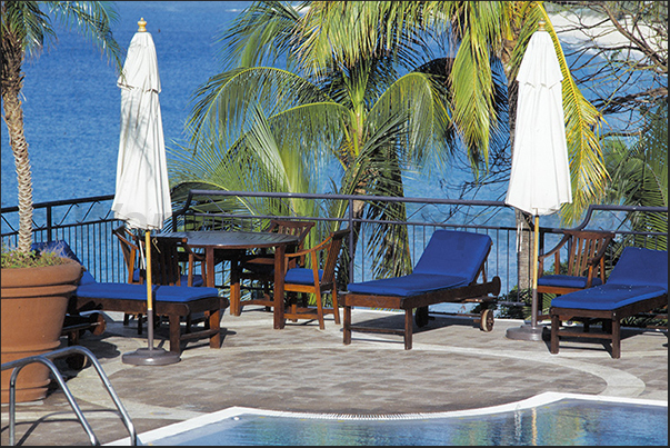 Relax in the pool in one of the most exclusive hotels in the French area, La Samanna Resort