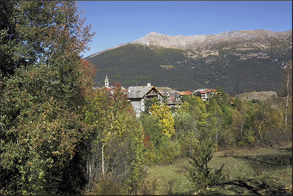 Chateau Beaulard alpine village (1387 m) behind Mount Jafferau (2805 m)