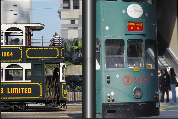 Ancient and modern ding-dings tram together on the streets of the city