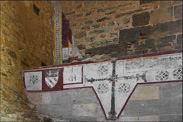 Remains of decorations that covered the walls of the staircase that leads to the church