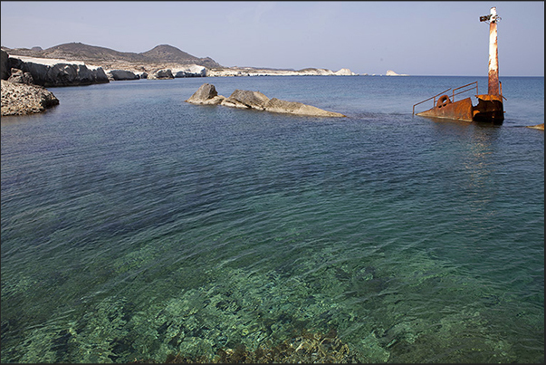 Rocky beaches of Sarakinikos. The remains of a shipwreck