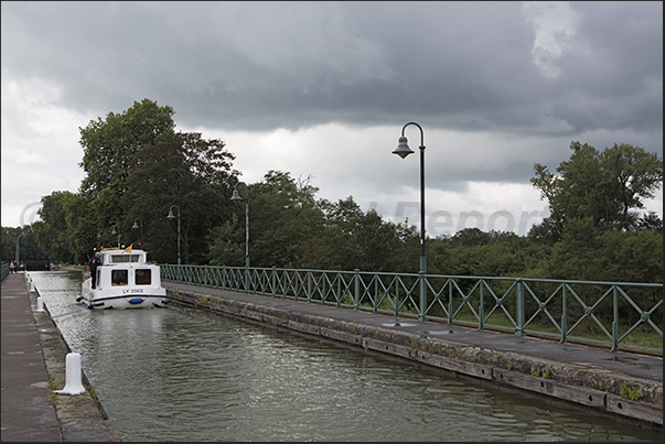 Passage on the fluvial bridge of Digoin a navigable bridge that crosses the river Loire