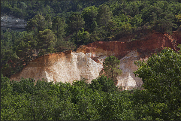 The valley of ocher and red earth called Provencal Canyon on the road from Rustrel to the village of Apt