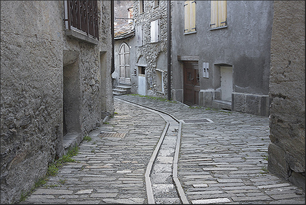 Stone-paved streets characterize the ancient mountain village of Laux