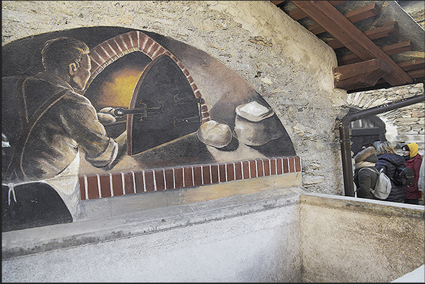 Usseaux. In the village murals and drawings tell stories and traditions of the alpine village