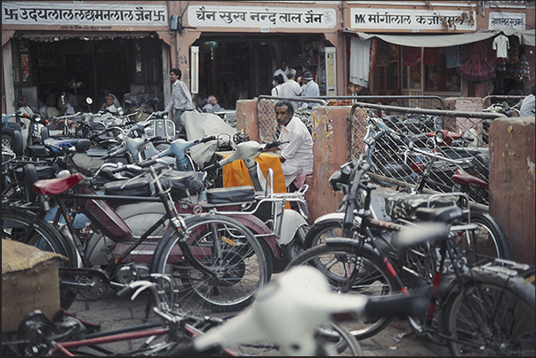 City of Jaipur. A tailor submerged by bicycles