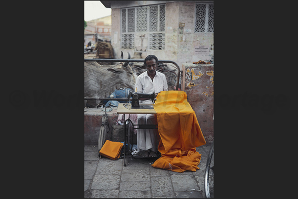 City of Jaipur. A tailor at work in the streets of the town