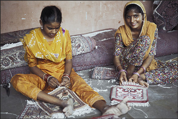City of Jaipur. Girls at work during the construction of carpets