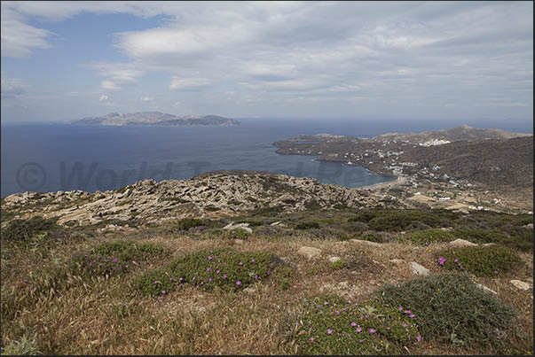 Panorama of the Mylopotas bay with the islands of Sikinos, Folegandros and Milos on the horizon