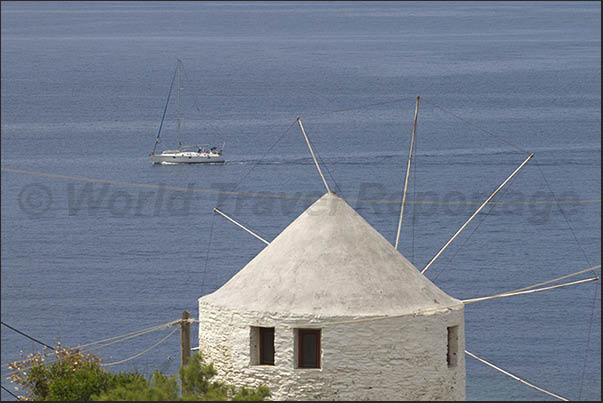 West Coast. Ancient and new mills converted to residence in the bay of Koundouros