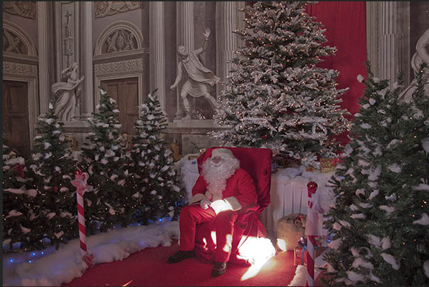 Santa Claus welcomes children to listen to their wishes and requests for Christmas