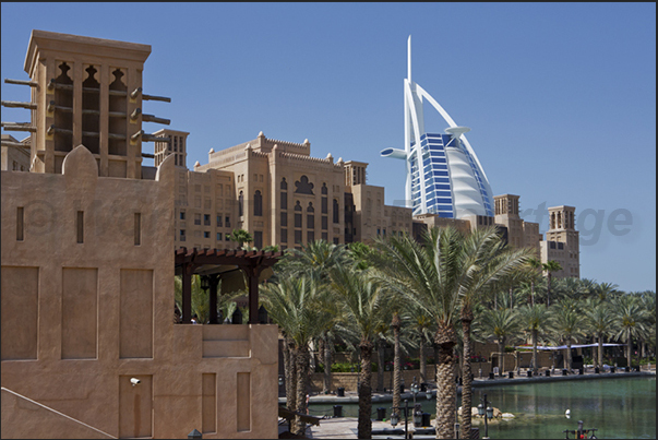Shopping center in the ancient fortress of Al-Fahdi in the old town of Bastakiya. Behind, the Burj Al Arab, known as The Sail