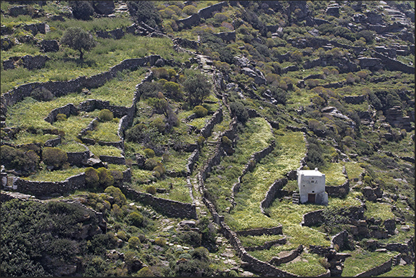 Paths flank dry stone walls and terraced crops characterize the valleys of the island