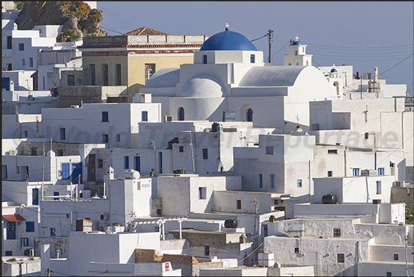 The pattern of white houses all the same and the domes of the churches characterize the city of Chora