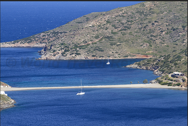 Apokrousi Bay with the sandy strip that connects the coast to the island of Kolona