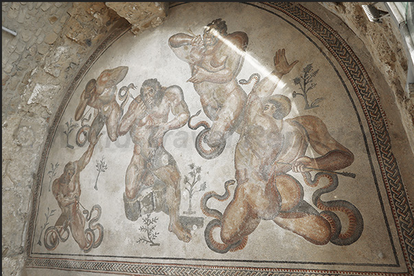 The triclinium room where dinners with dances and music were organized. The mosaics represent Hercules and some Gods The triclinium room where dinners with dances and music were organized. The mosaics represent Hercules and some Gods