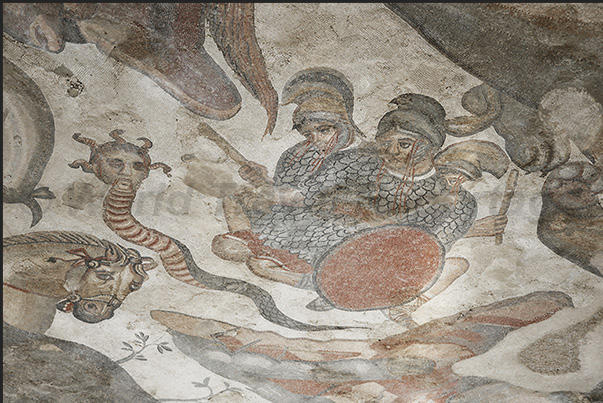 The triclinium room where dinners with dances and music were organized. The mosaics represent Hercules and some Gods The triclinium room where dinners with dances and music were organized. The mosaics represent Hercules and some Gods