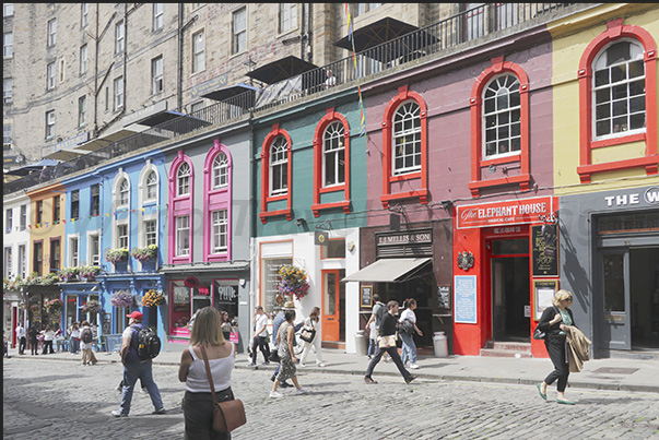 Victoria Street a splash of colour among grey buildings. The most popular street for tourists with shops, pubs and restaurants