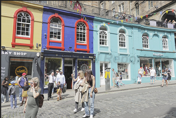 Victoria Street a splash of colour among grey buildings. The most popular street for tourists with shops, pubs and restaurants