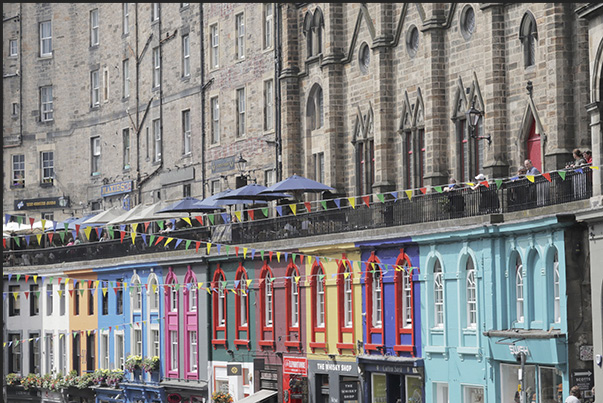 Victoria Street a splash of colour among grey buildings. The most popular street for tourists with shops, pubs and restaurants