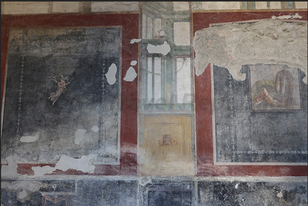 The columned patio in the center of the villa with well-preserved frescoes of Roman life and culture on the walls