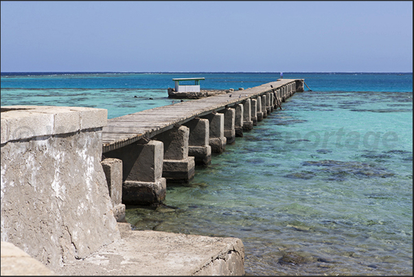 The north jetty of the lighthouse that connects the island with the large lagoon formed by the coral reef of Sanganeb