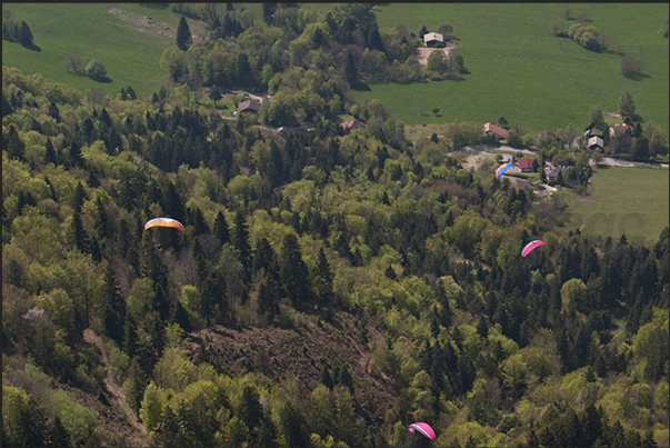 Flying on the forest of the Col de la Forclaz. South east coast of the lake