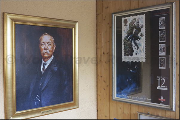 Sir Conan Doyle and, in the stamp on the right, the depiction of the death of S.Holmes in the waters of Reichenbach Falls