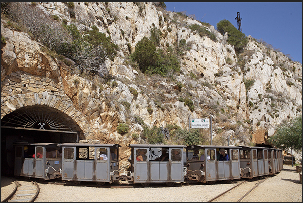 Train mine of Henry Gallery near Buggerru. The train that once pulls carts full of ore out in the mine, now pulls carts full of tourists