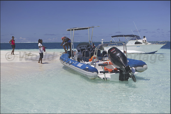 Sand bank in the lagoon, one of favorite places from the tourists that, on board fast boats, they reach the reef