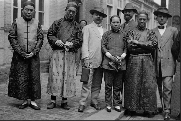 Tourists posing with a group of Chinese