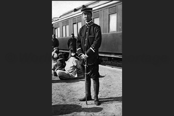 Rail station of Pukow. A small town on the railway line Canton - Beijing. A Chinese policeman