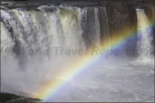 Rainbow over the Godafoss waterfalls, located on the road to the town of Akureyri