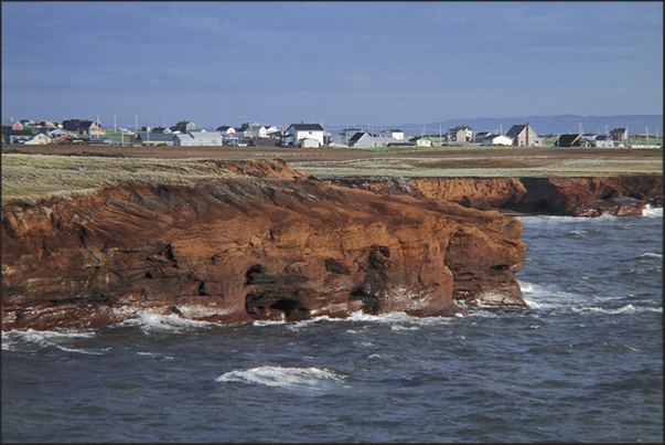 Cap aux Meules Island. The red cliffs along the West Coast