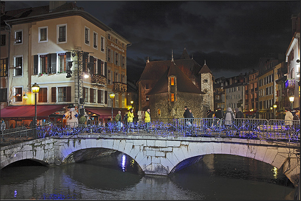 In the evening, during the Christmas season, the medieval town of Annecy is illuminated with lights and colors