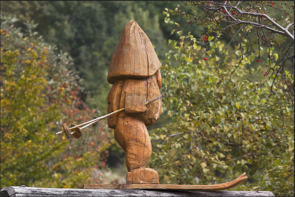 In the village of Alpe Artignaga, a craftsman produces wooden sculptures