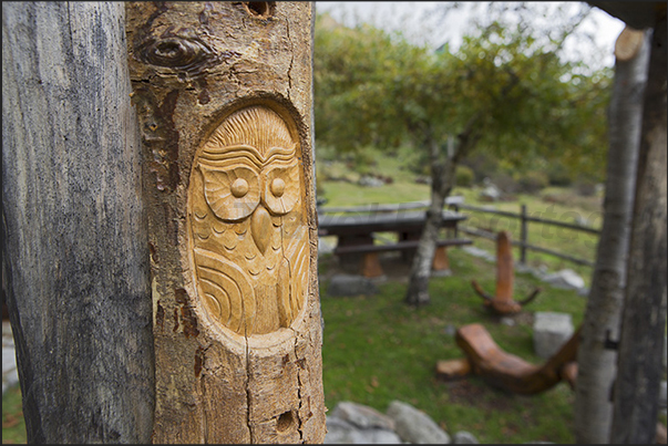 In the village of Alpe Artignaga, a craftsman produces wooden sculptures
