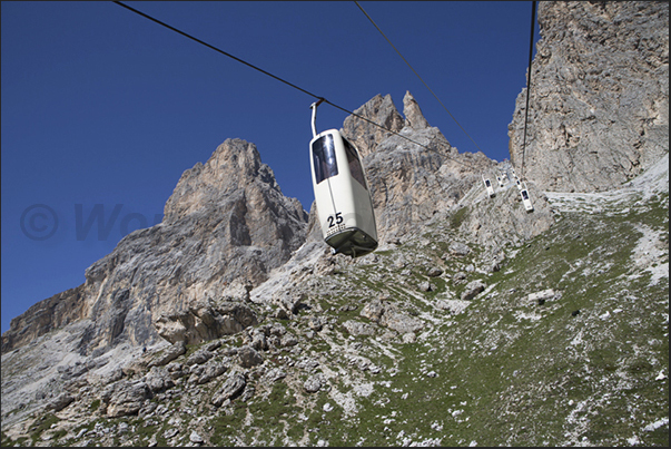 Ascent by cable car from Passo Sella to refuge Demetz