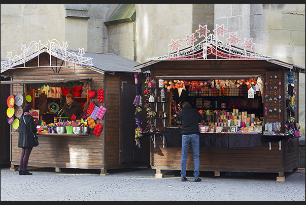 Towards evening, the stalls of Christmas markets light up of lights and colors