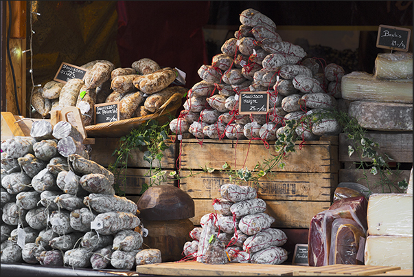 A stand with fragrant and delicious local sausages and salami