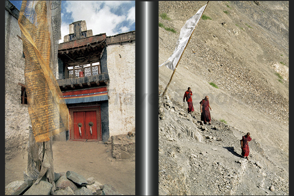 Town of Leh. Prayer flags near a little Gompa (Tibetan Buddhist temple) while a group of monks left the monastery