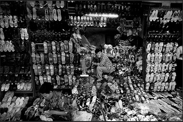 Hanoi. Neighborhood in the old part of the town. A store of sandals and shoes