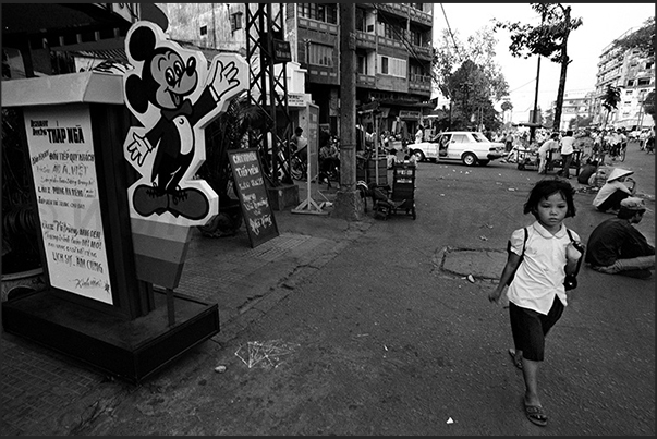 Ho Chi Minh City (Saigon). Mickey Mouse in front of a karaoke restaurant