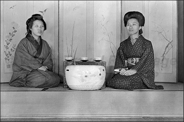 Japan. Yokohama. Two women in the tea room
